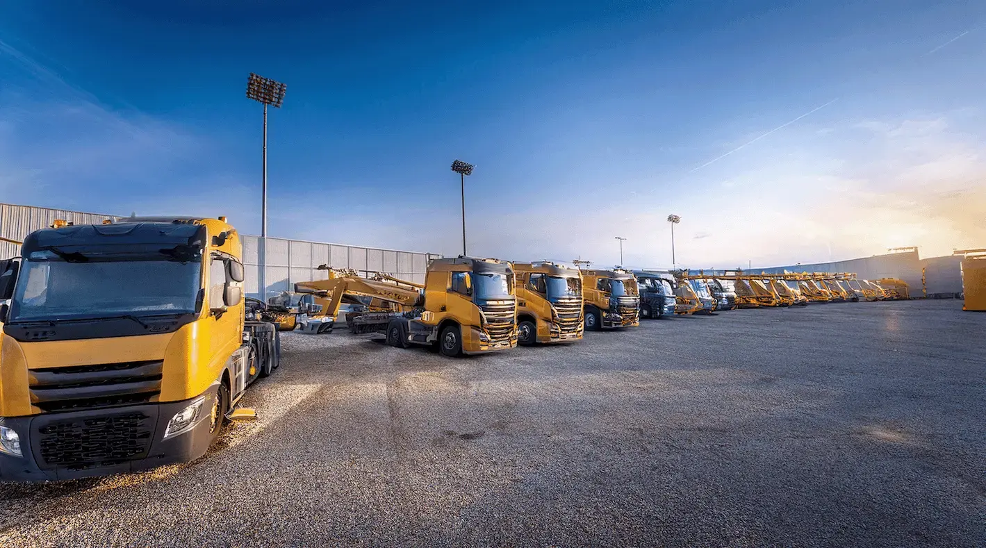 An organized AI-generated rental lot with a large fence and good lighting.